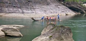 rafting on a bamboo raft in the beautiful mountain gorge.