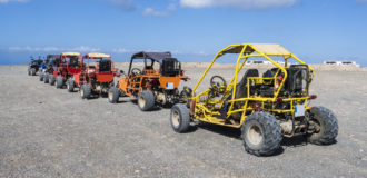 Beach buggies on tour on an excursion on the Canary Island Fuerteventura.